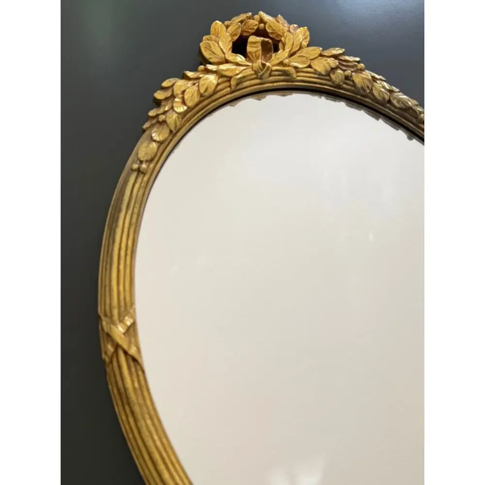 Vintage Hollywood Regency style mirror gold classic leaf wreath and ribbon crest